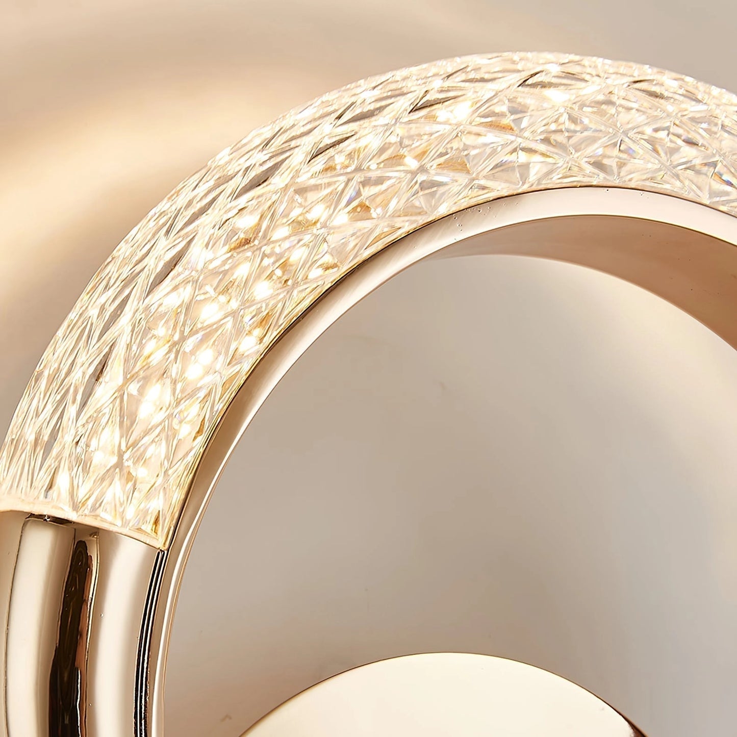 Luxurious metallic wall lamp with rotatable angle, featuring a gold finish and wood accents, designed with circular elements.