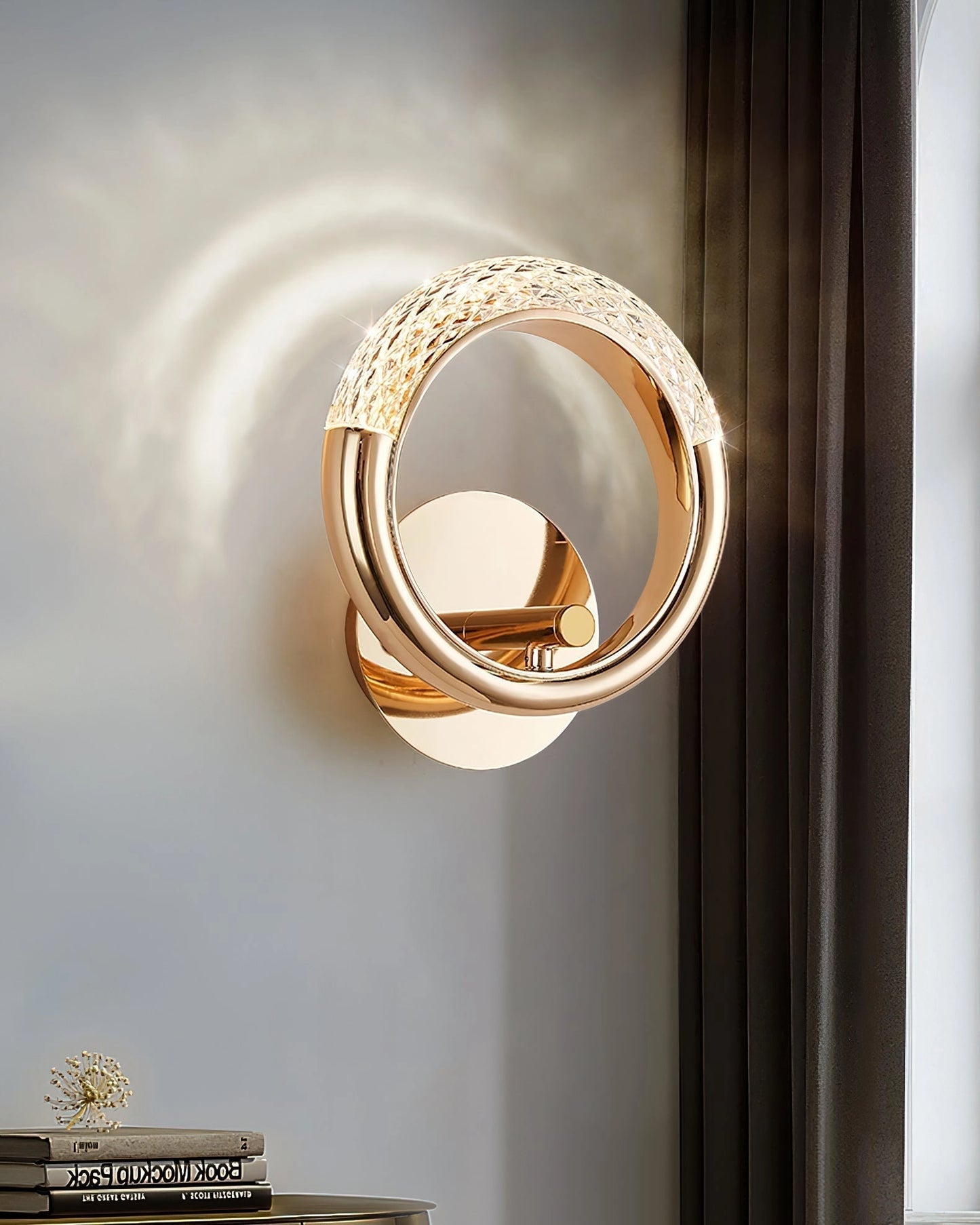 Luxurious metallic wall lamp with a gold finish, featuring a rotatable angle design and wooden accents, mounted on a wall.