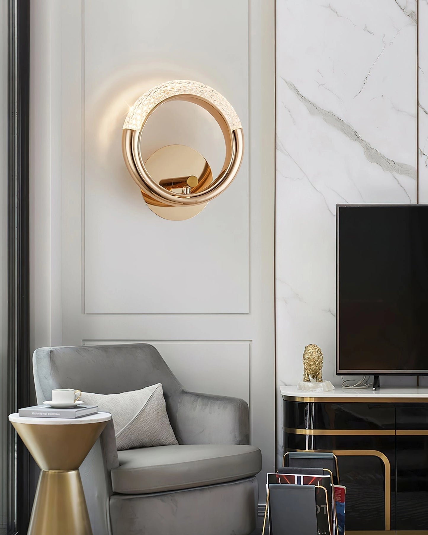 Luxurious metallic wall lamp with an adaptable angle rotatable design, mounted on a wall above a modern couch in a stylishly furnished interior.