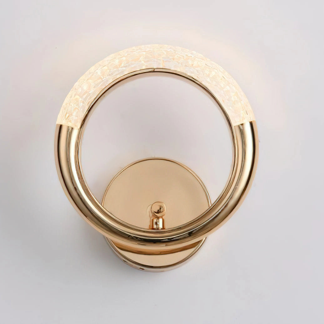 Adaptable Angle Rotatable Wall Lamp with a Luxurious Metallic Design mounted on a wooden wall, showcasing its sleek circular metal frame and adjustable features.
