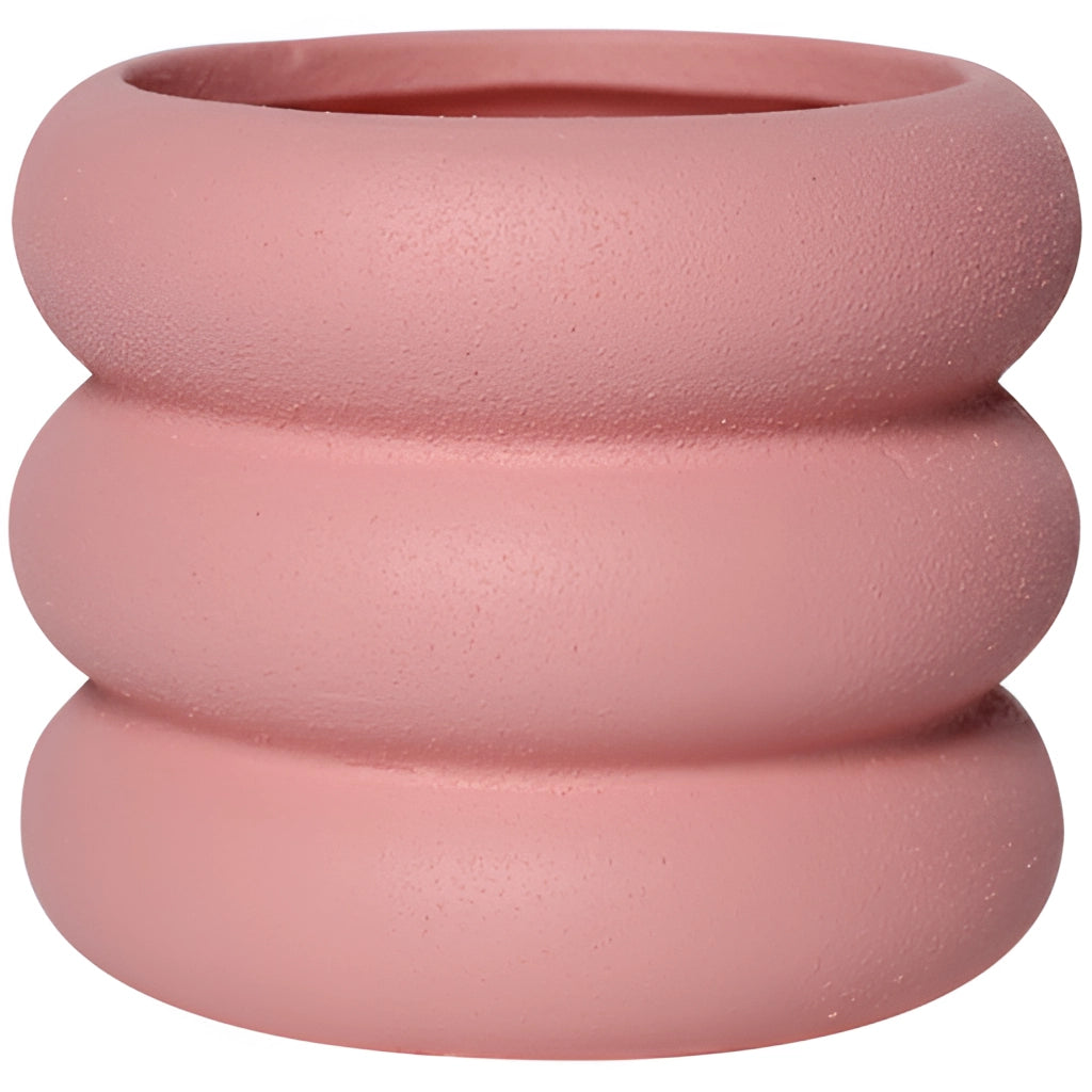 Ceramic round plant pot in peach color with a smooth, glossy finish and circular design.