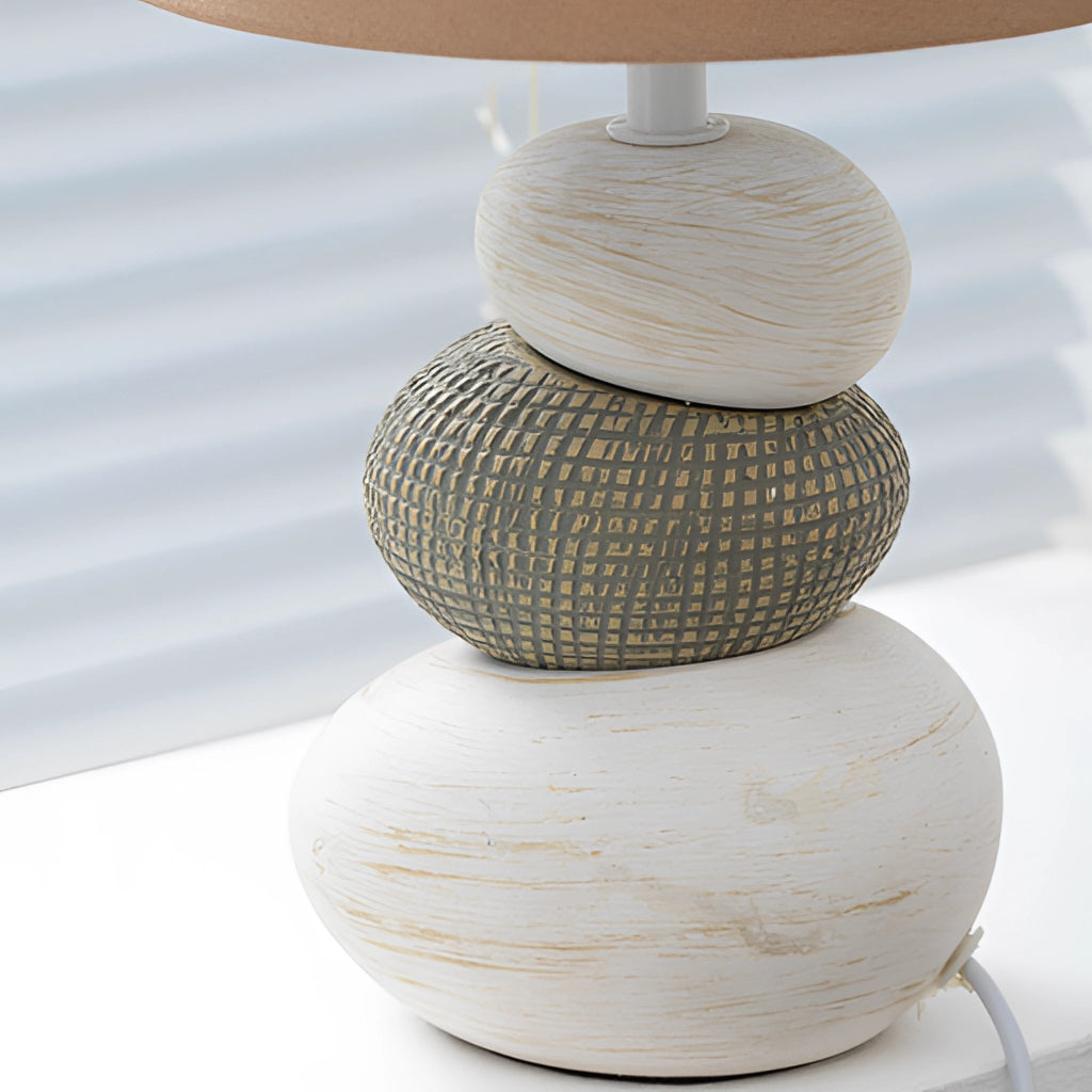 Contemporary fabric lampshade in white and beige tones, featuring natural wood accents and artistic patterns, suitable for desk or nightstand.
