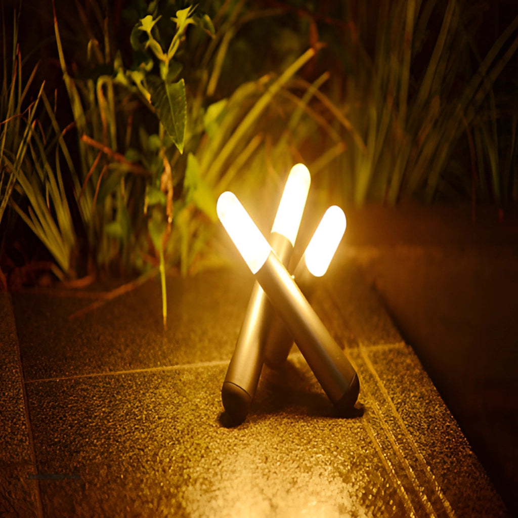 Cordless Kinetic Rotation LED Table Lamp on a wooden surface near a plant with sunlight streaming in.