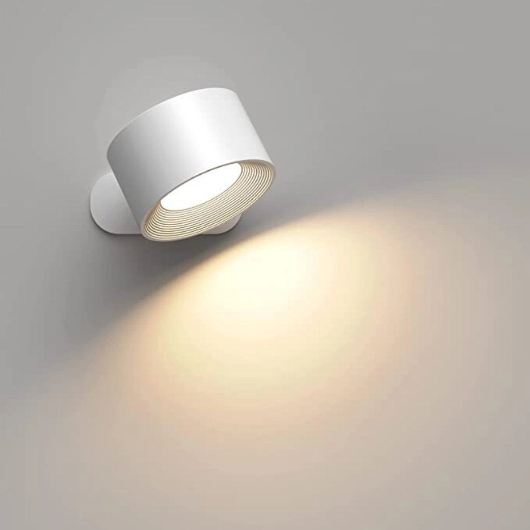 White Cordless LED Wall Lamp with Adjustable Brightness and Color Modes, featuring a sleek, circular design and modern metal finish, mounted on a wall.