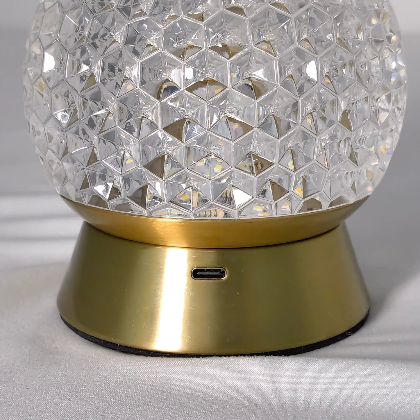 Modern cordless rechargeable table lamp with a dimmable LED light, featuring a sleek nickel finish and circular metal design.