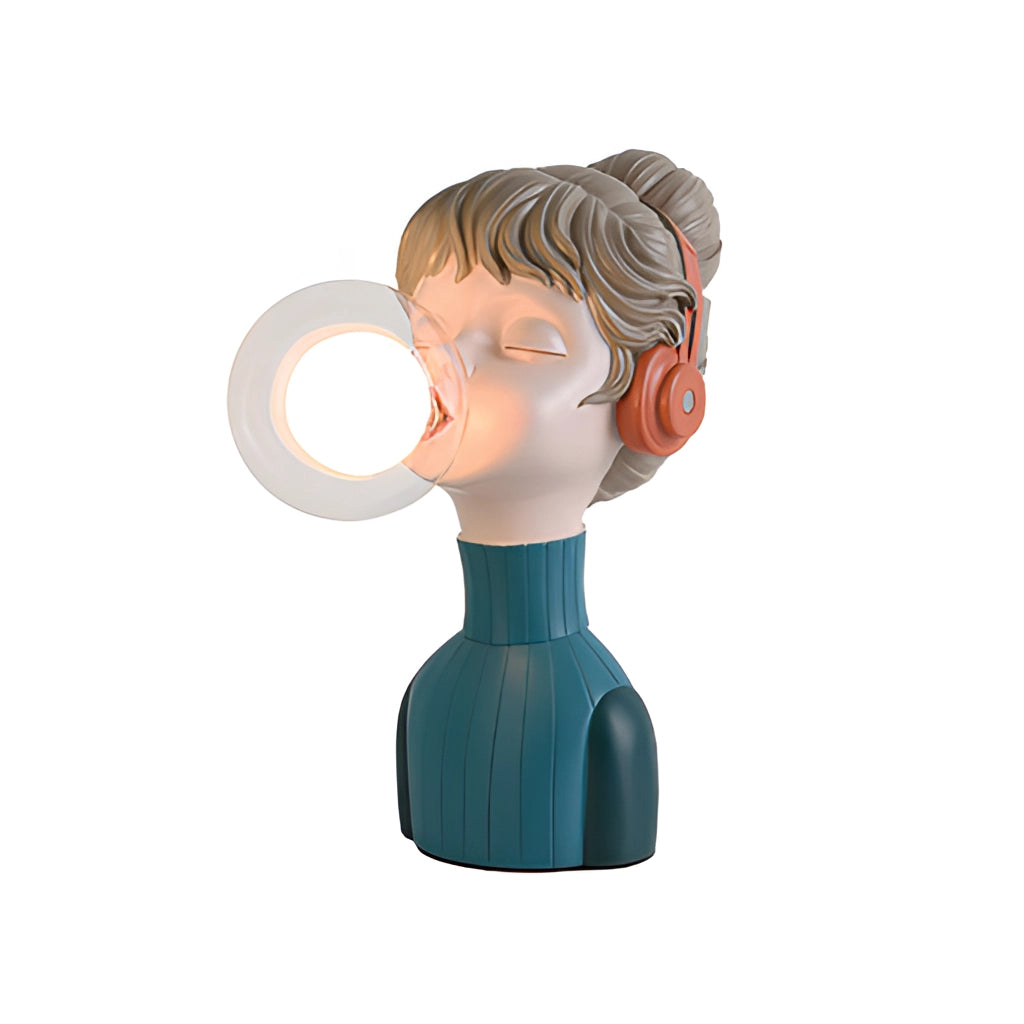 A chic minimalist desk lamp in orange and green resin displayed on a surface.