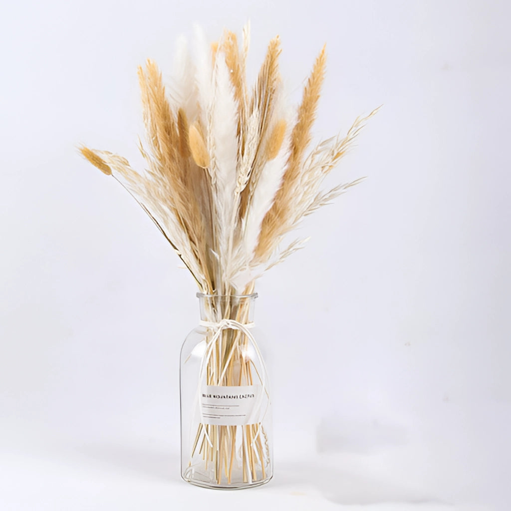 A 30-piece set of dried pampas grass flowers arranged in a vase, displayed on a wooden table, ideal for interior decoration.