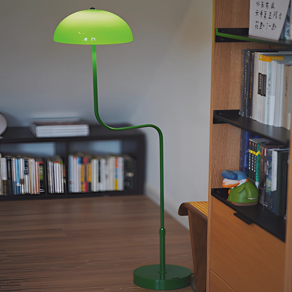 Floor lamp with green and white tricolor light next to a wooden bookcase in a well-designed interior.
