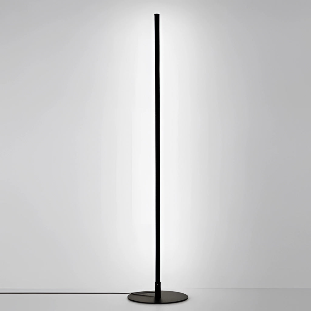 Avant-garde style floor lamp emitting white light, positioned near a computer monitor and other electronic devices, creating a modern and tech-savvy ambiance.