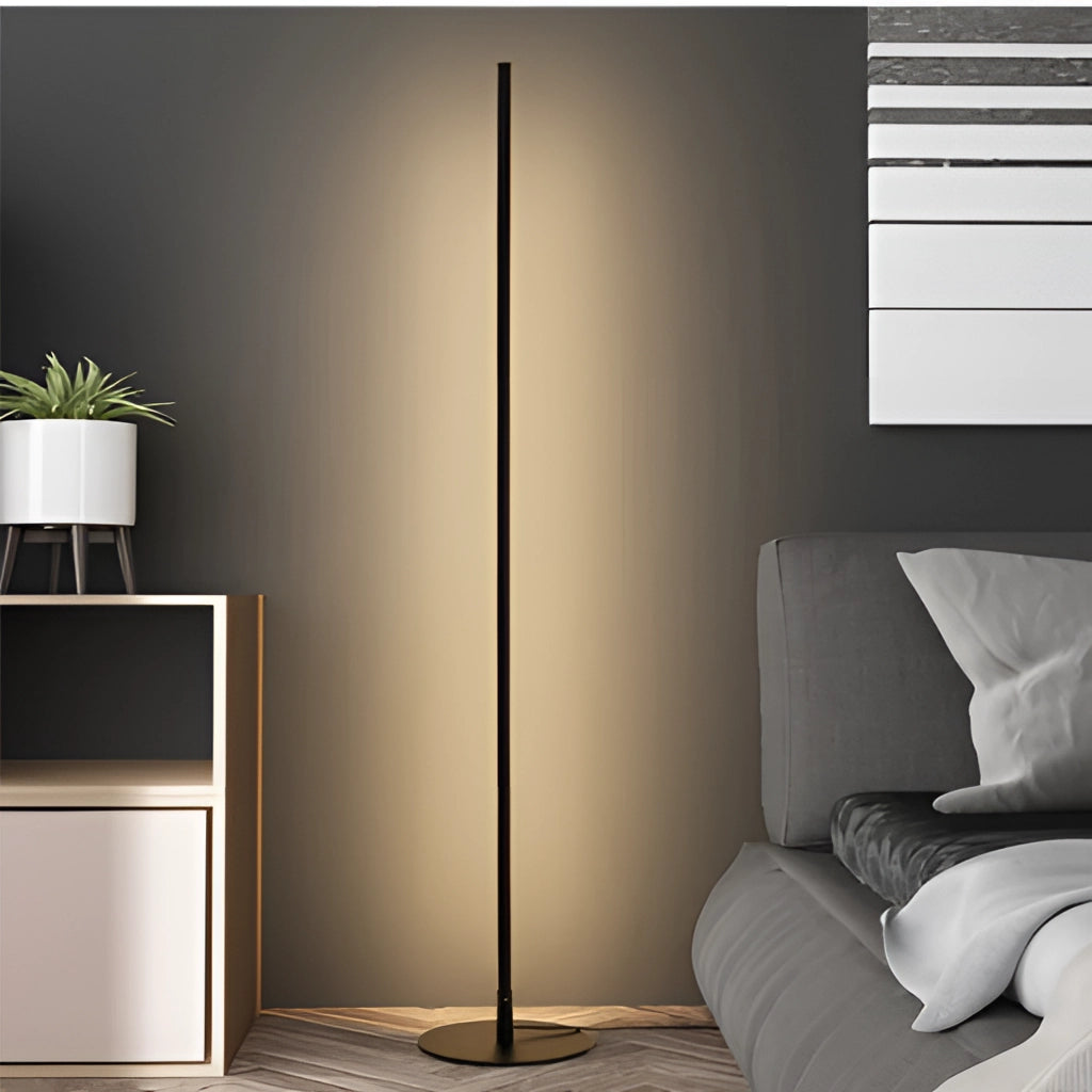 Avant-garde style floor lamp with versatile lighting, placed in a modern interior setting with wood flooring, a plant in a flowerpot, and comfortable decor elements.