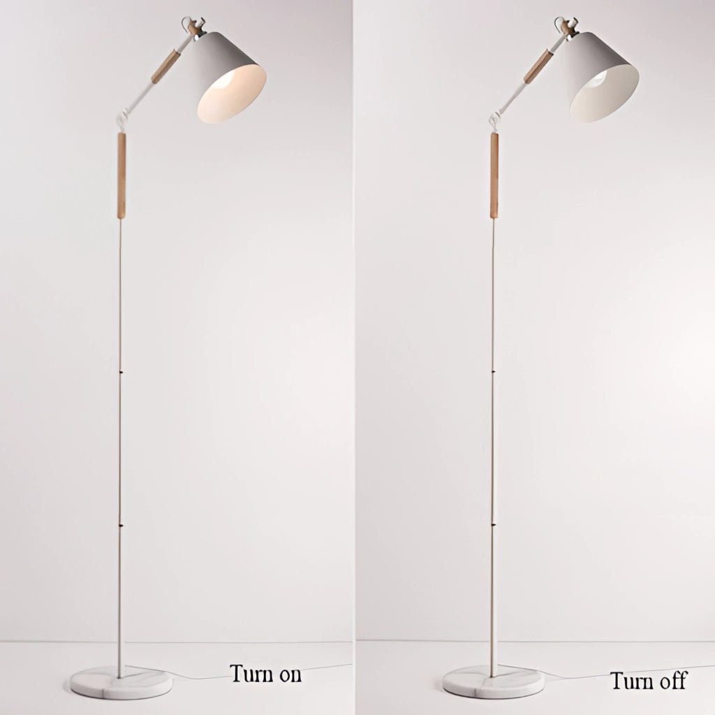 Modern white floor lamp with a marble base standing on wooden flooring, illuminating a room with versatile lighting against a white wall and ceiling.
