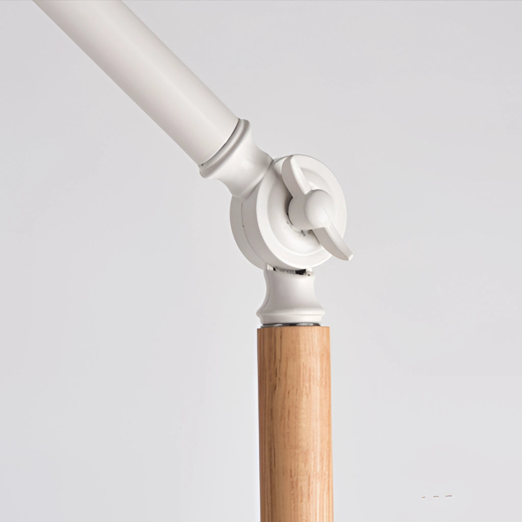 Floor lamp with marble base and versatile lighting, featuring a sleek metal and wood design, positioned in a room with hardwood floors.