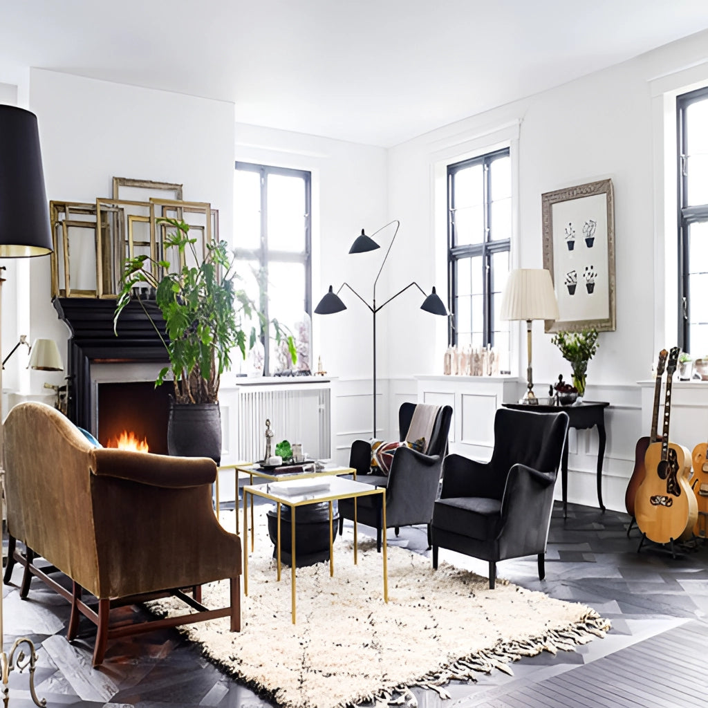 A modern floor lamp with a tripod base and directional light positioned in a stylish living room featuring a couch, table, houseplant, and large window.