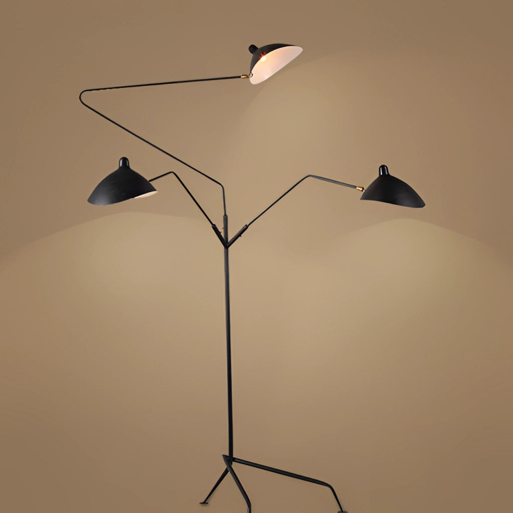 A floor lamp with a tripod base and a directional light, featuring a modern design with a sleek lampshade.
