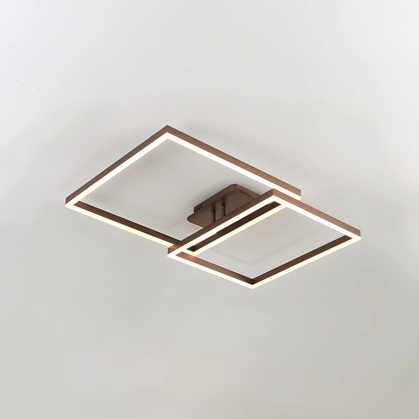 Modern geometric aluminum pendant light with LED technology in a rectangular brown frame, featuring cool light hanging from the ceiling.