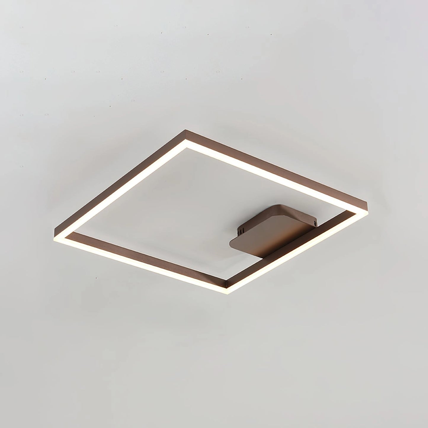 Modern Geometric Aluminum Pendant Light in Brown with LED Technology, featuring an artistic design and cool light, hanging from the ceiling.