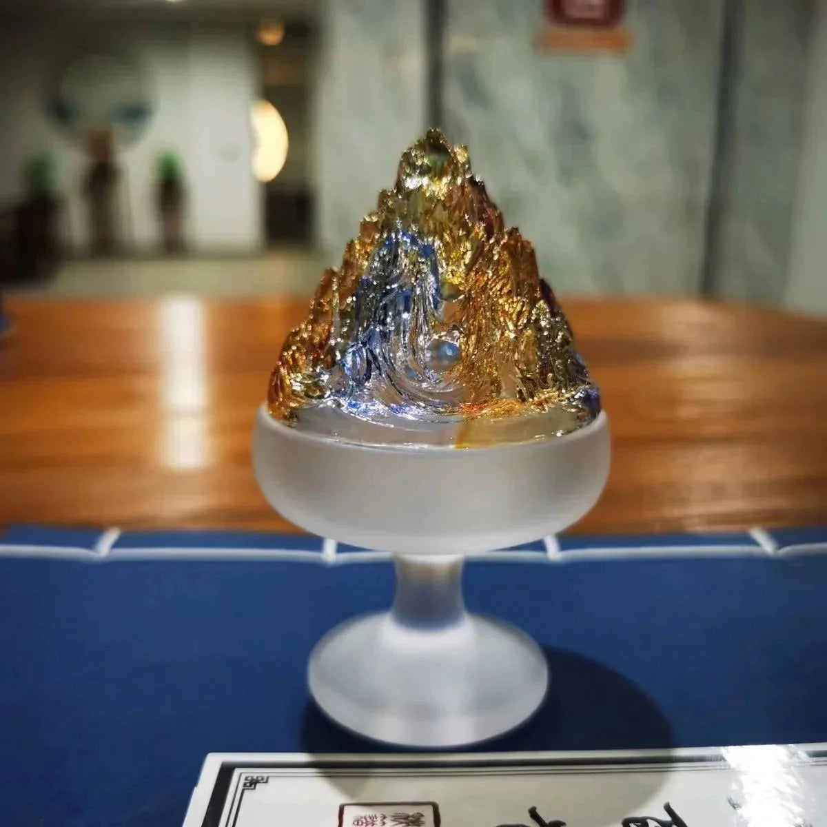 A glass incense burner for Zen home decor placed on a table.