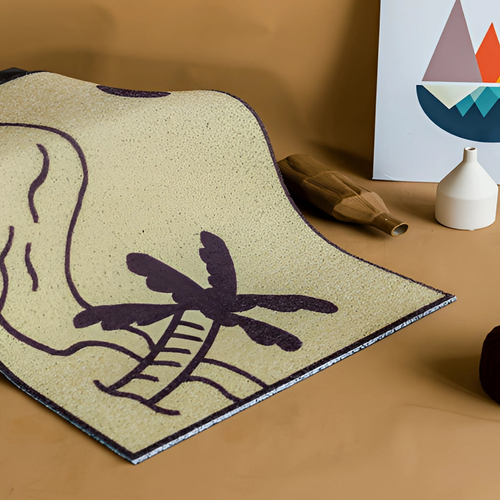 Indoor/Outdoor Tropical Aloha PVC Rug Mat with black tropical pattern on a wooden floor.