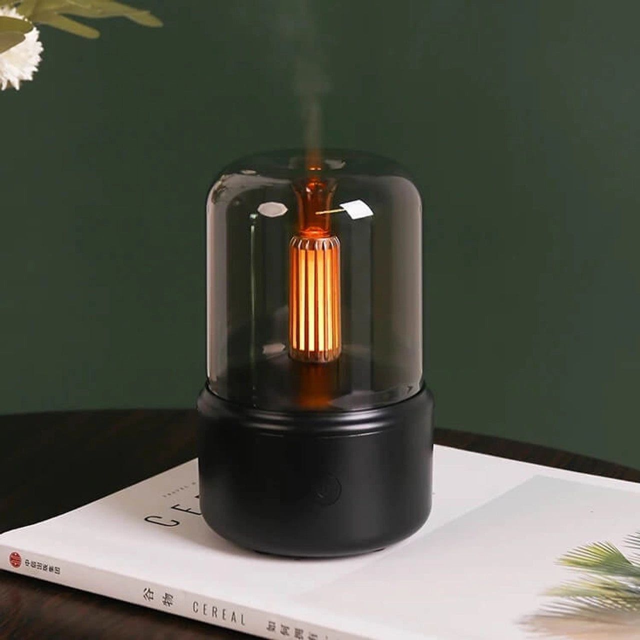 LED aromatherapy diffuser with candle light effect, featuring a sleek cylindrical design.