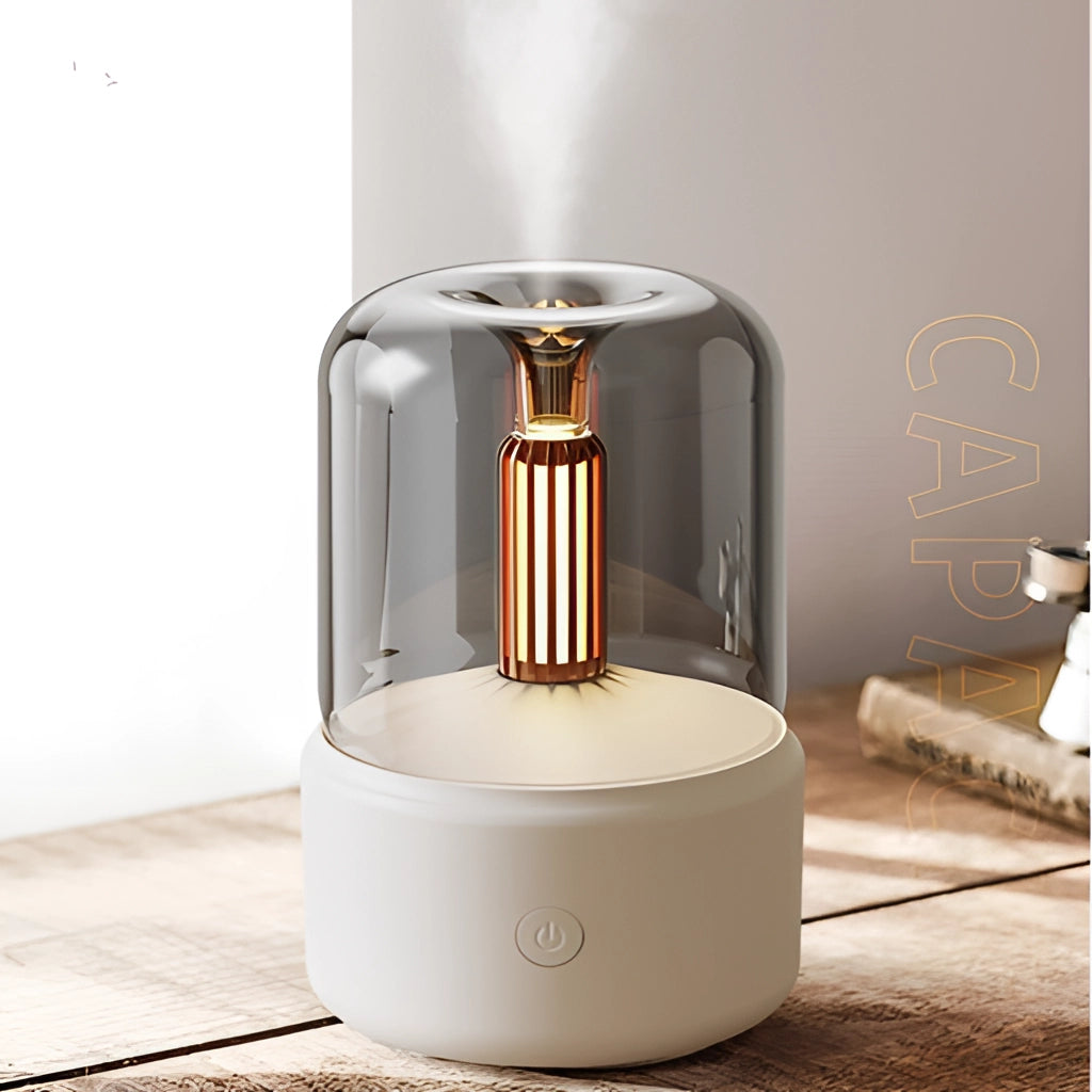 LED Aromatherapy Diffuser with Candle Light Effect, featuring a sleek cylindrical design with a metallic finish, emitting a warm, soothing light.