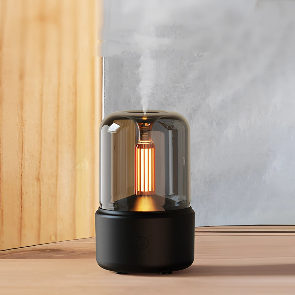 LED Aromatherapy Diffuser with Candle Light Effect, cylindrical shape, metallic finish, resembling a stylish fashion accessory.