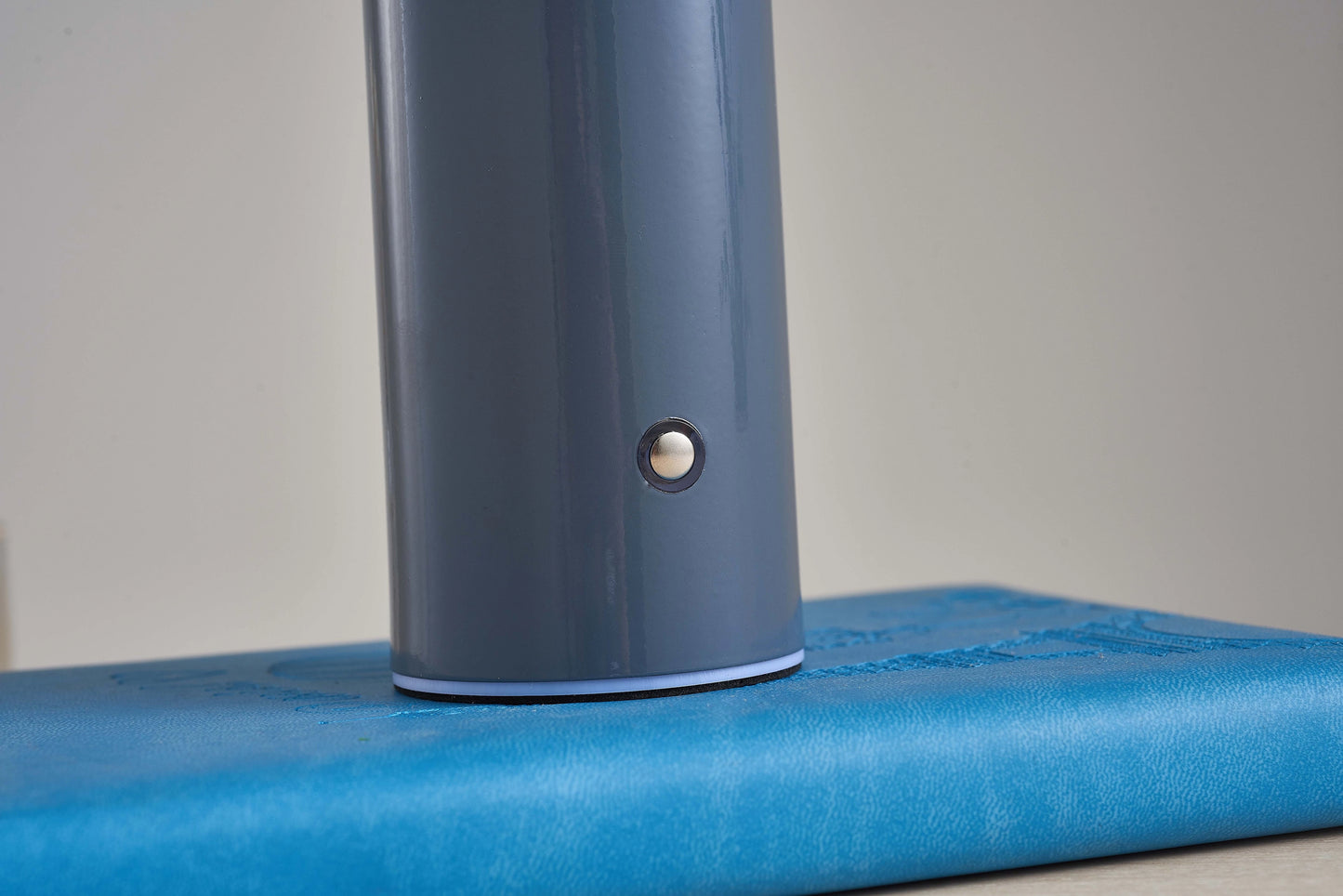 LED cordless table lamp with unique mushroom design in electric blue color, featuring a sleek cylindrical body and metallic accents.