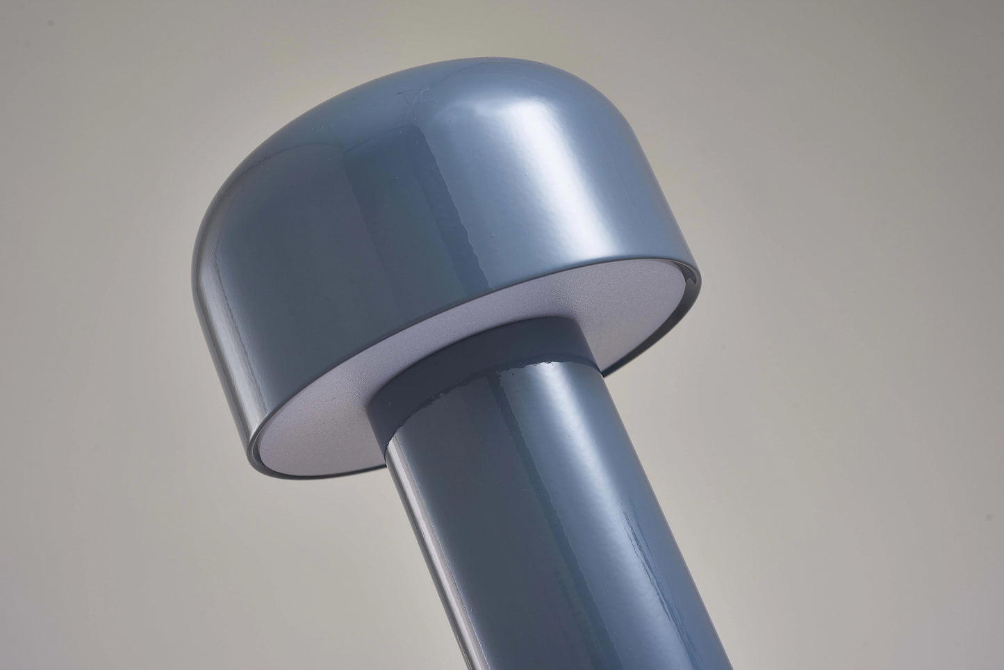 LED Cordless Table Lamp with Unique Mushroom Design featuring a sleek, cylindrical metal body and a soft glow, perfect for modern interior decor.