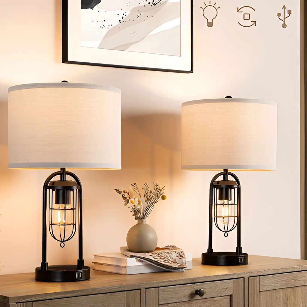 LED desk lamp with dual bulb modeling and USB ports on a wooden countertop, surrounded by cabinetry and a small plant in a stylish interior setting.