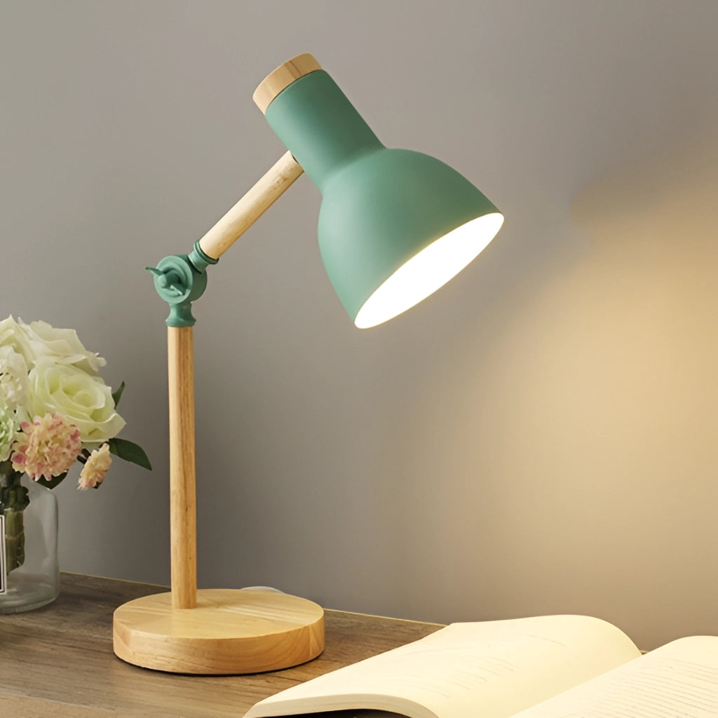 LED desk lamp with Scandinavian minimalist design in green, featuring energy-efficient lighting and a switch for three color settings, placed on a wooden table next to a small flower vase.