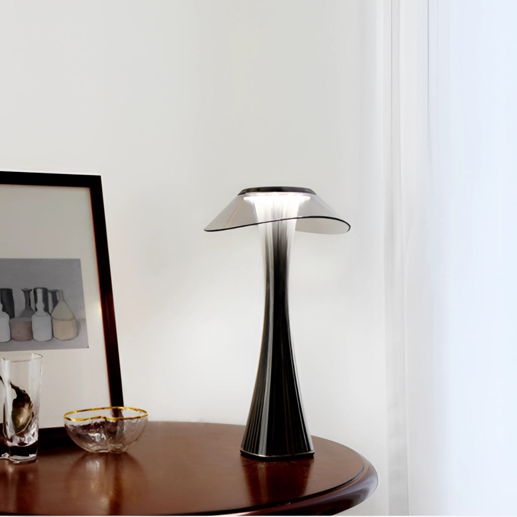 LED Diamond Desk Light on a wooden table with shelving and art pieces in the background.