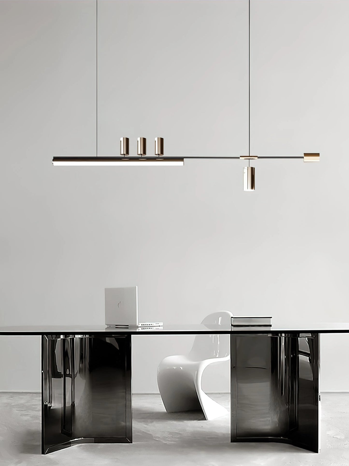 Nordic-inspired LED pendant light with adjustable wire, warm and cool light options, hanging above a modern grey table and chairs in a stylish interior setting.