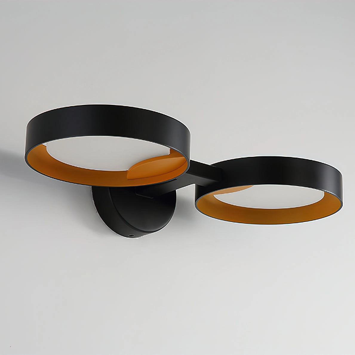 Contemporary iron and acrylic LED wall light with artistic design, featuring sleek metal accents and modern aesthetics.