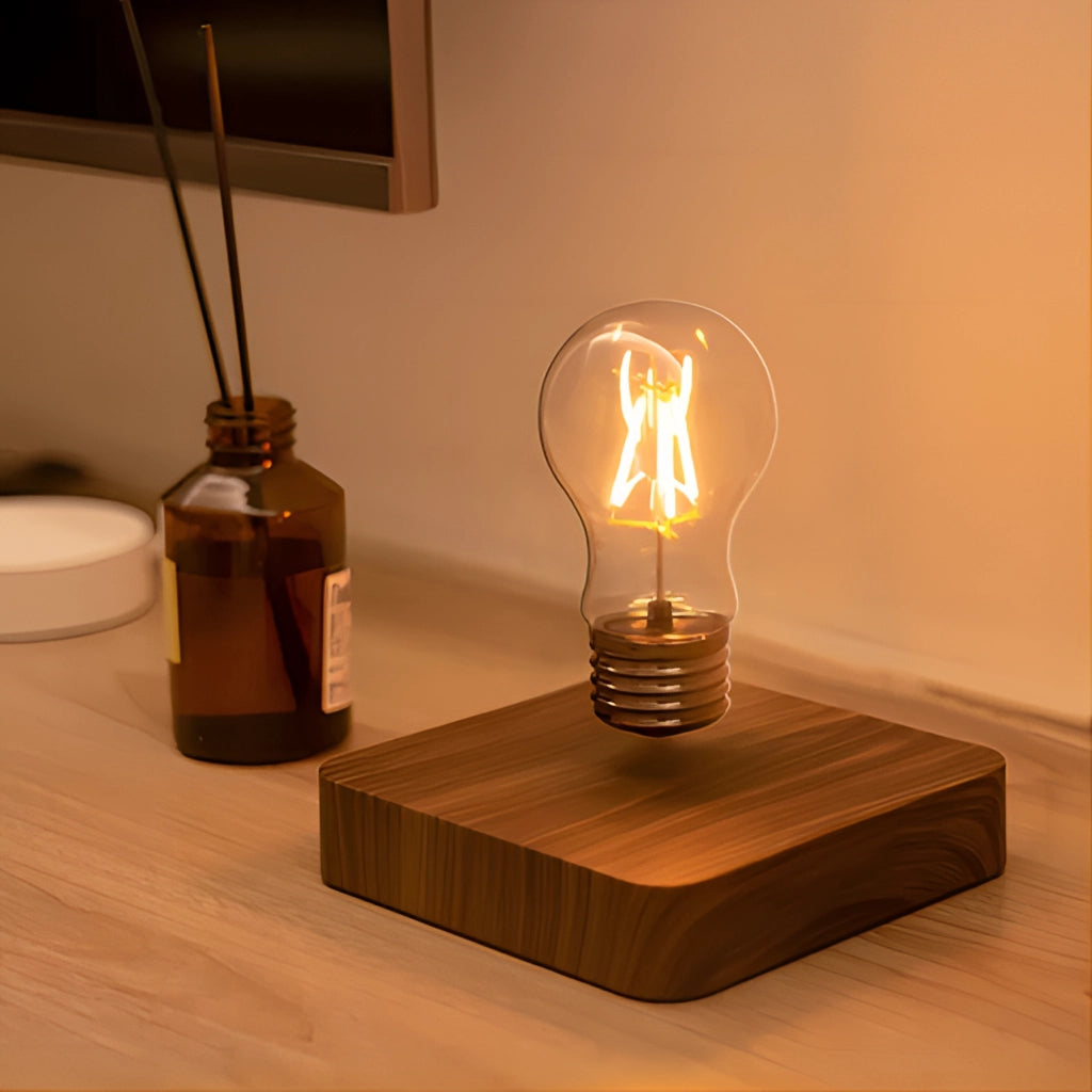 Levitating LED desk lamp with walnut base, illuminating a modern interior design space.