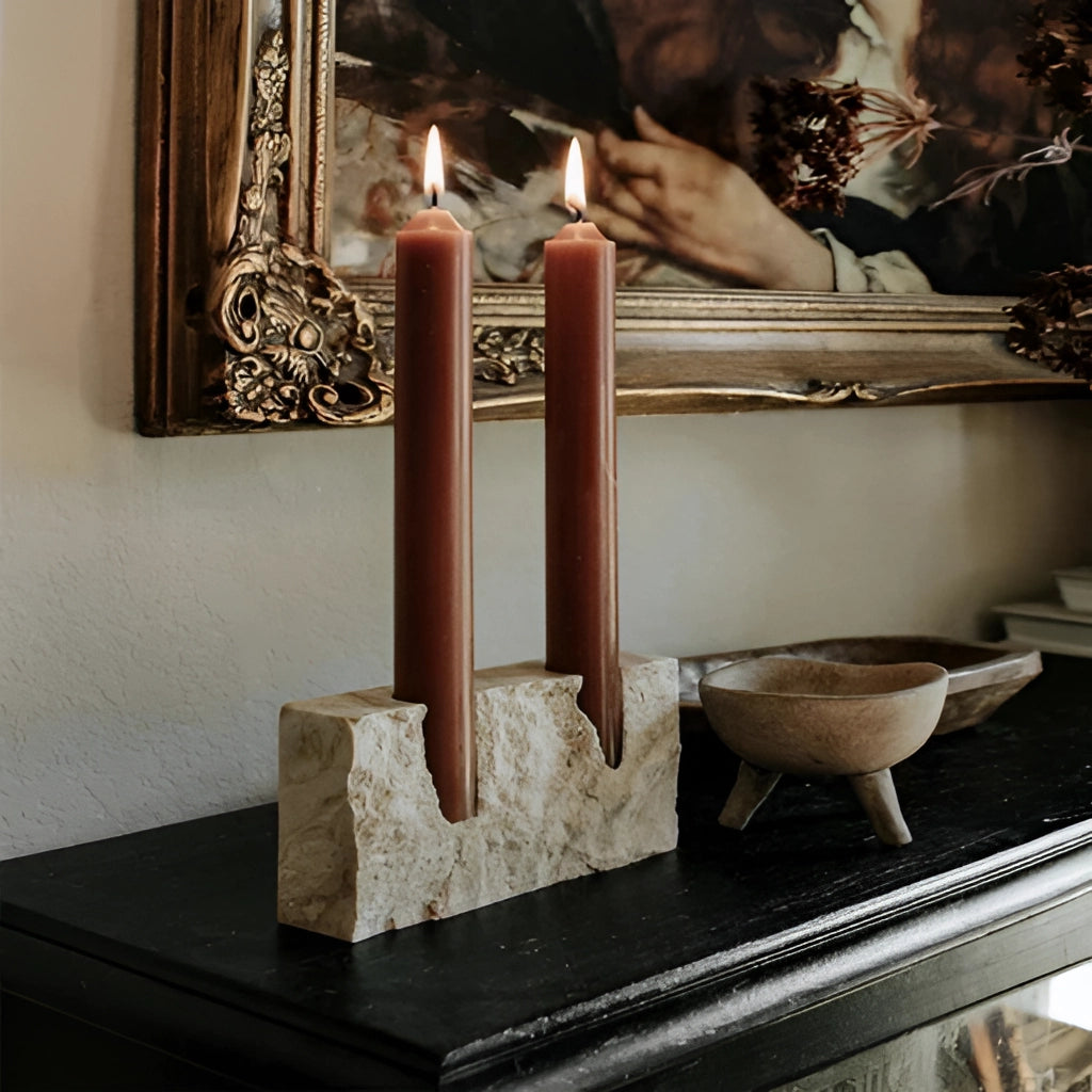 Marble candle holder with a lit candle, placed on a wooden table, suitable for weddings and parties.