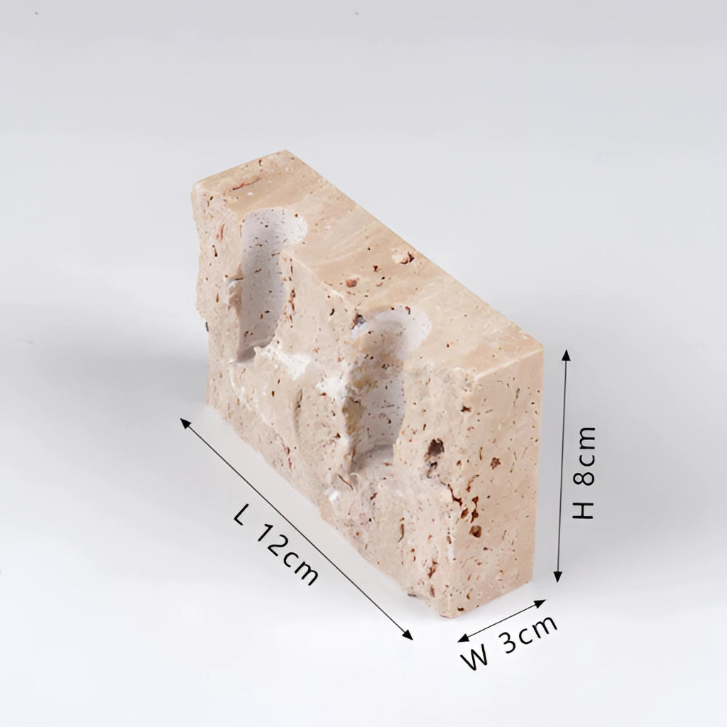 Broken marble candle holder for weddings and parties, rectangular, featuring metal accents, displayed with various tableware items.