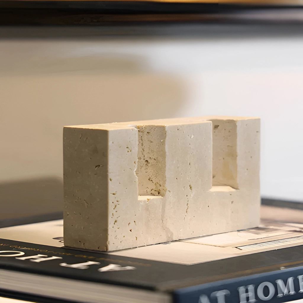 Rectangular marble candle holder placed on a wooden surface, ideal for weddings and parties.