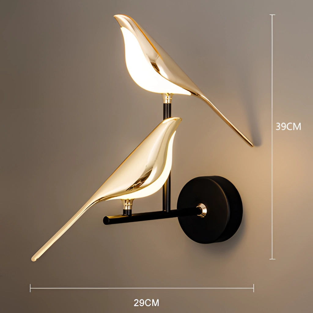 Modern rotatable wall sconce with a 360-degree gold lampshade featuring two heads and emitting warm light, mounted on a wooden wall.