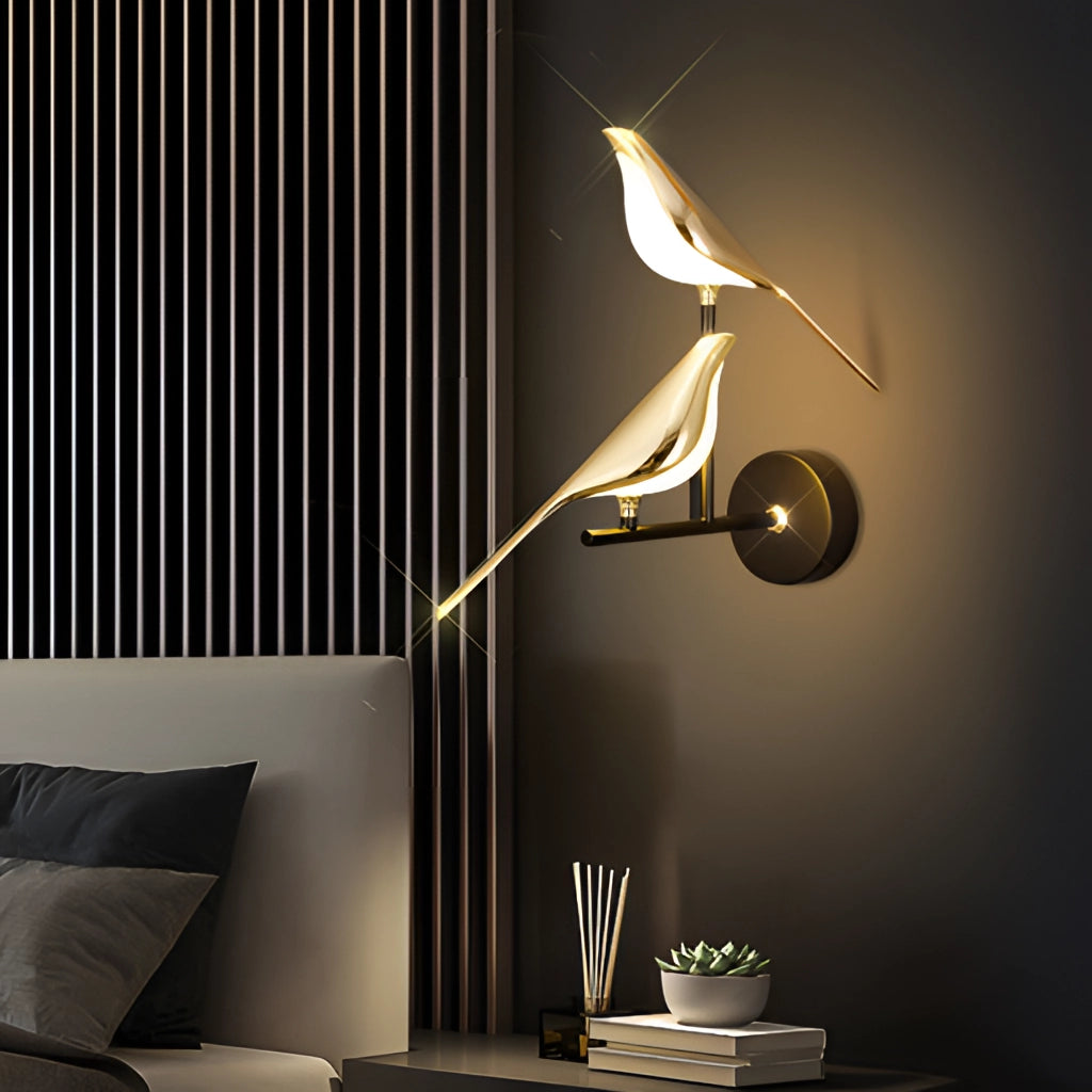 Modern rotatable wall sconce with a 360-degree gold lampshade mounted above a wooden table near a black couch, providing warm yellow light for added comfort and artistic ambiance.