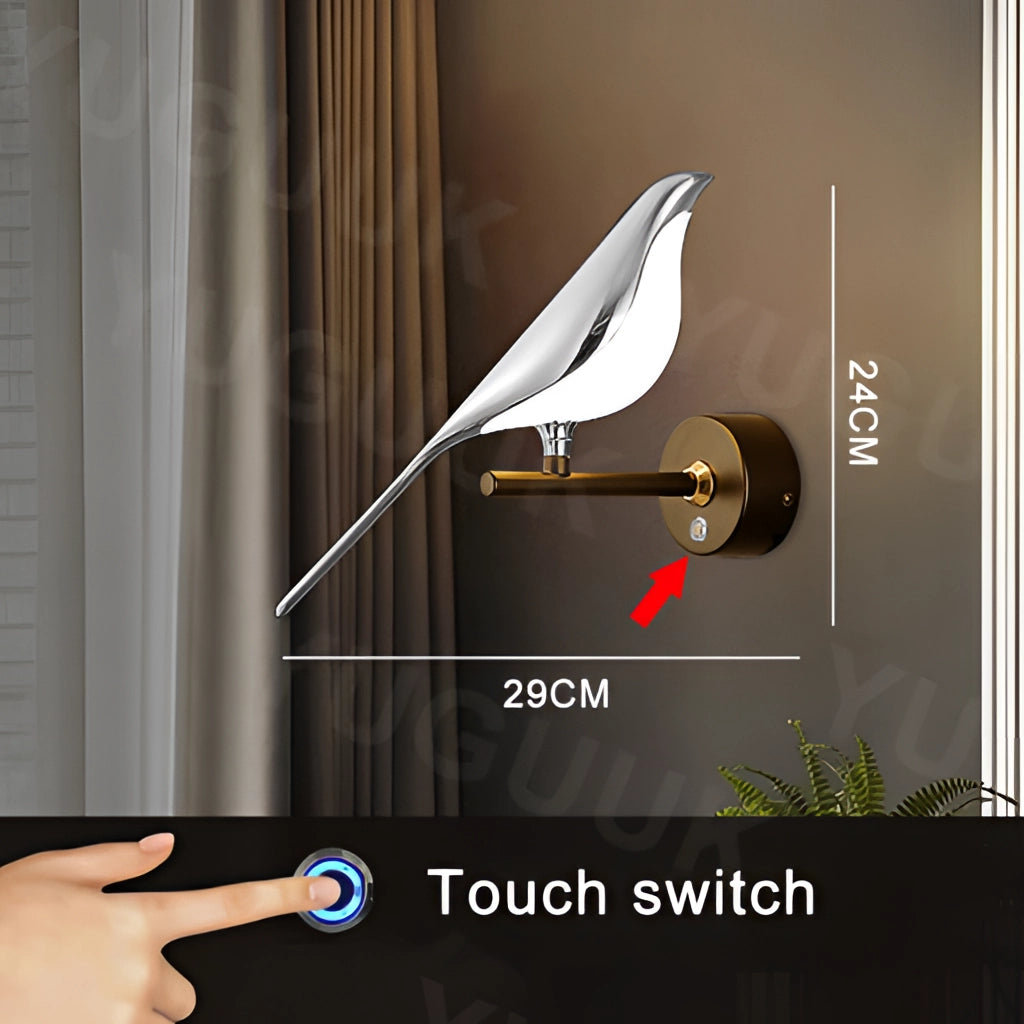 Modern rotatable wall sconce with a 360-degree silver lampshade, warm light illumination, mounted on a wood-paneled wall.