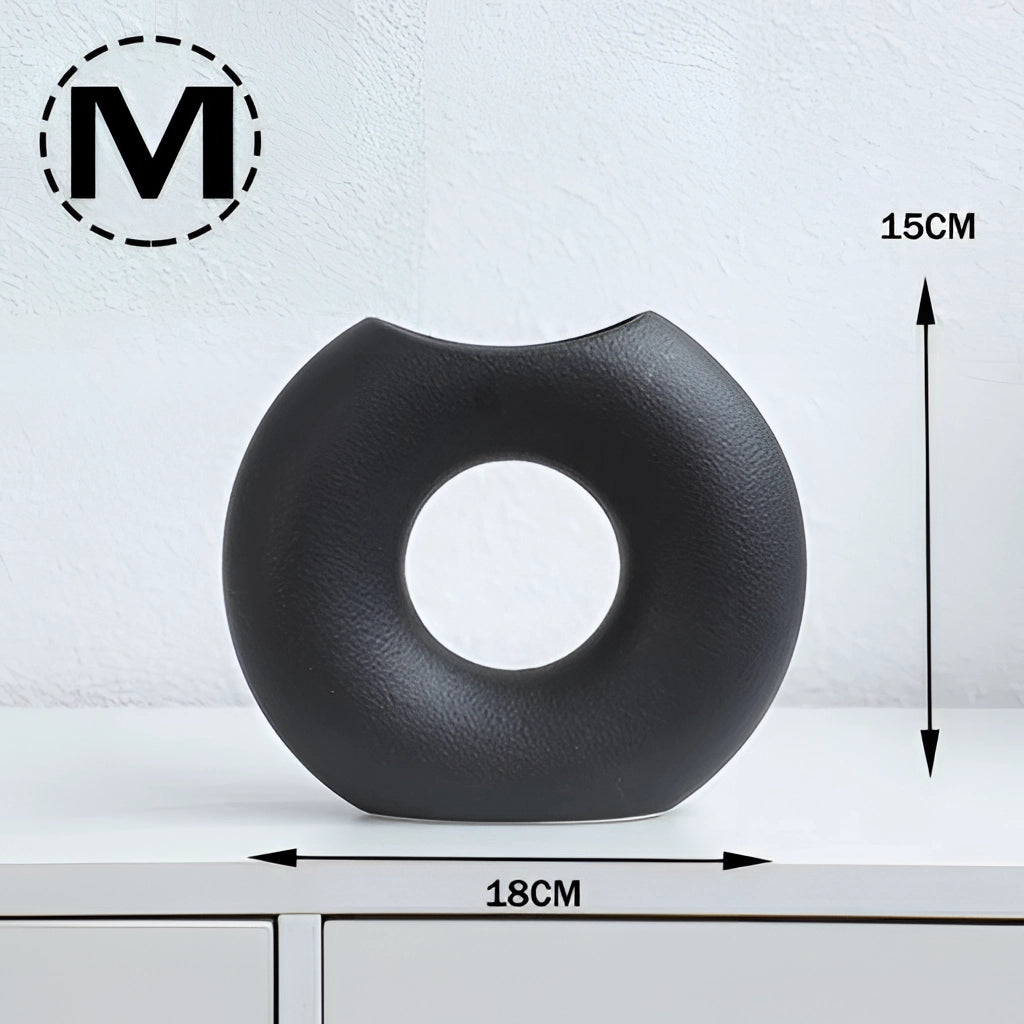 Black Nordic style ceramic donut vase with a modern circular design, suitable for office and living room decor.