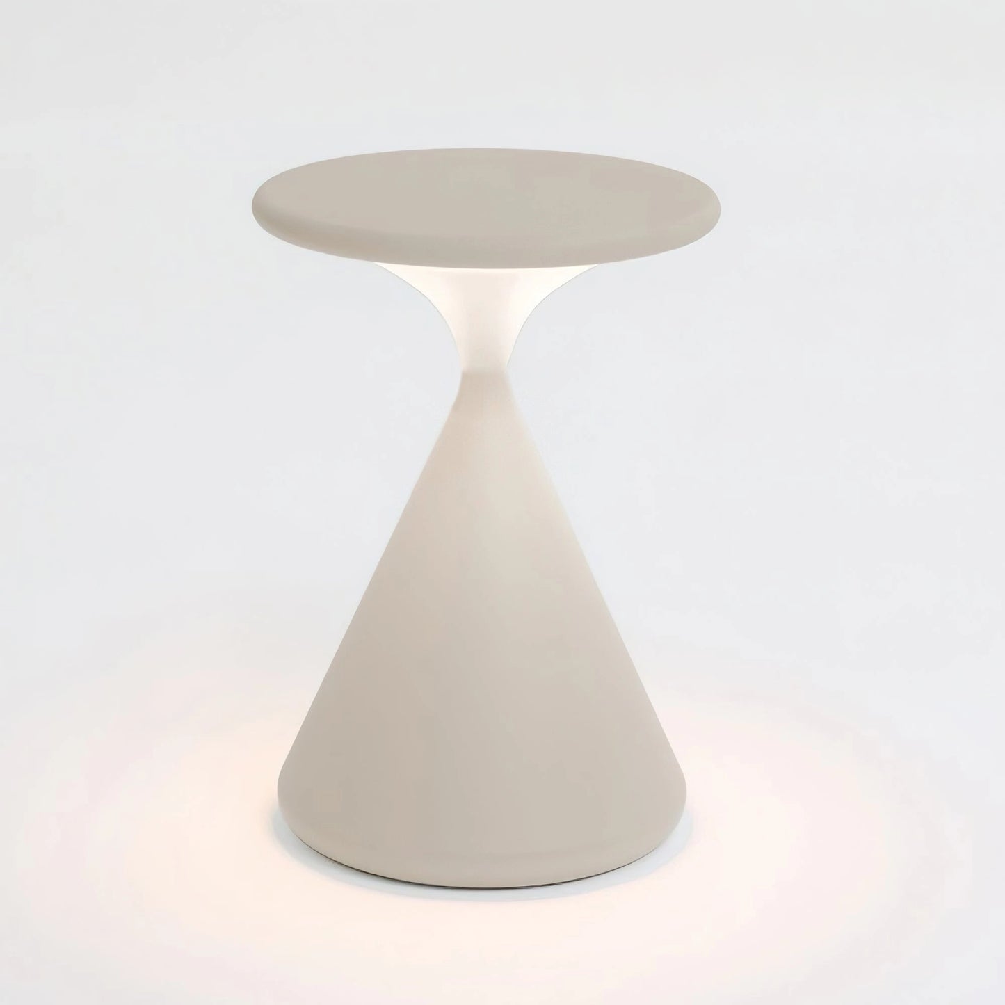Outdoor cordless lamp with a white, cool light, measuring 9.8 inches in diameter and 7.1 inches in height, placed on a wooden table with tableware and chairs nearby, providing versatile and elegant ambiance.