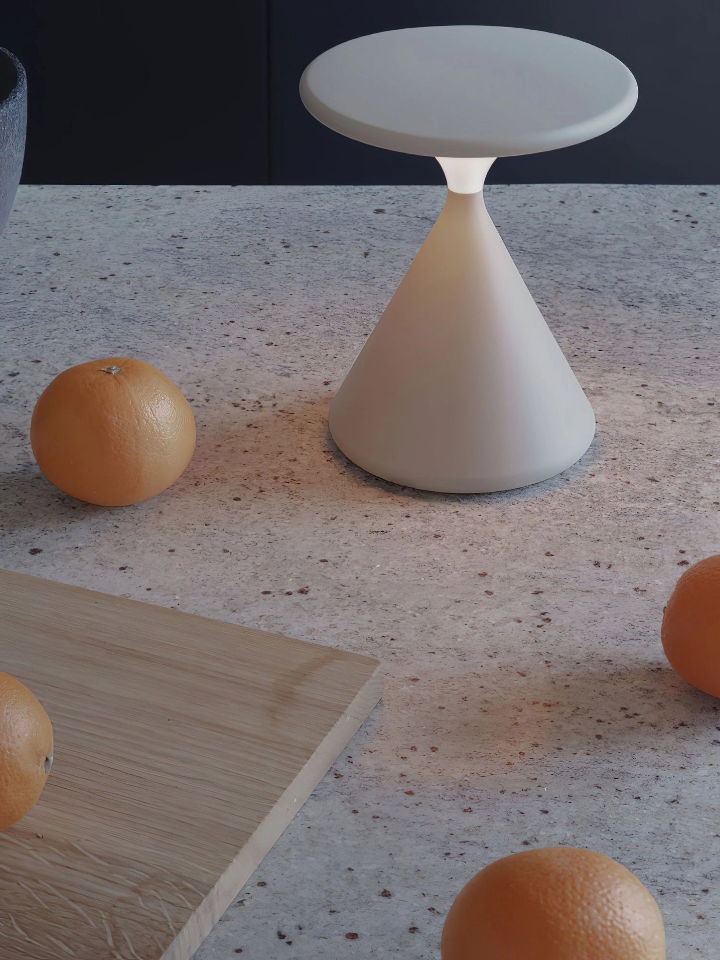 Outdoor cordless lamp for portable ambiance in an elegant design, placed on a wooden table with beige flooring in the background.