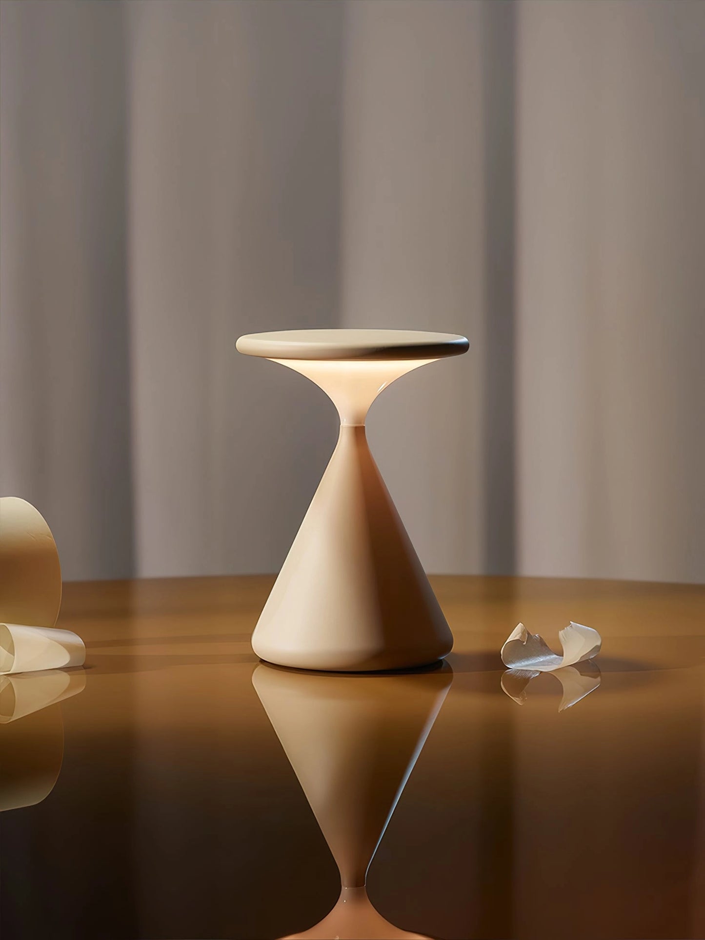 Elegant and versatile outdoor cordless lamp "Selene" providing portable ambiance, placed on a wooden table, illuminating the space with its sleek and modern design.