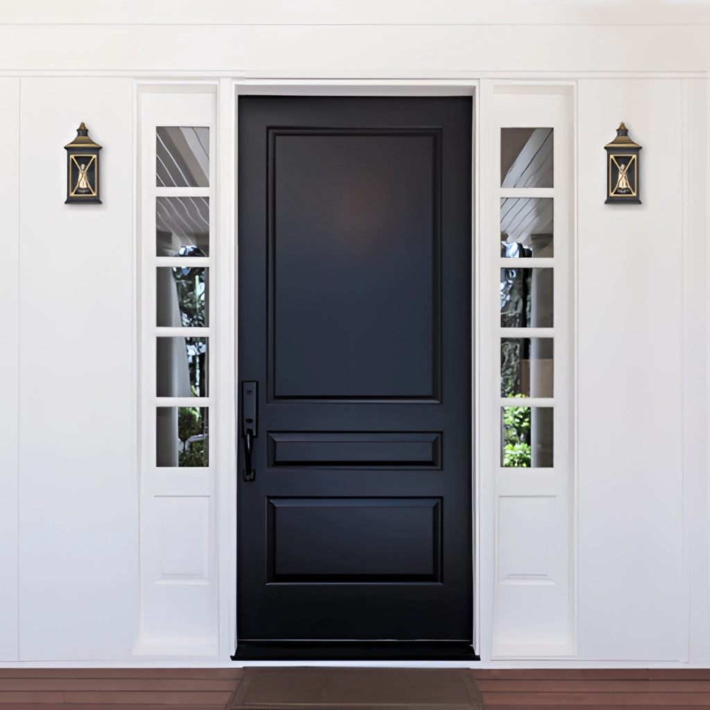Outdoor vintage bronze candle wall sconce mounted beside a wooden home door with rectangular panels and a door handle.