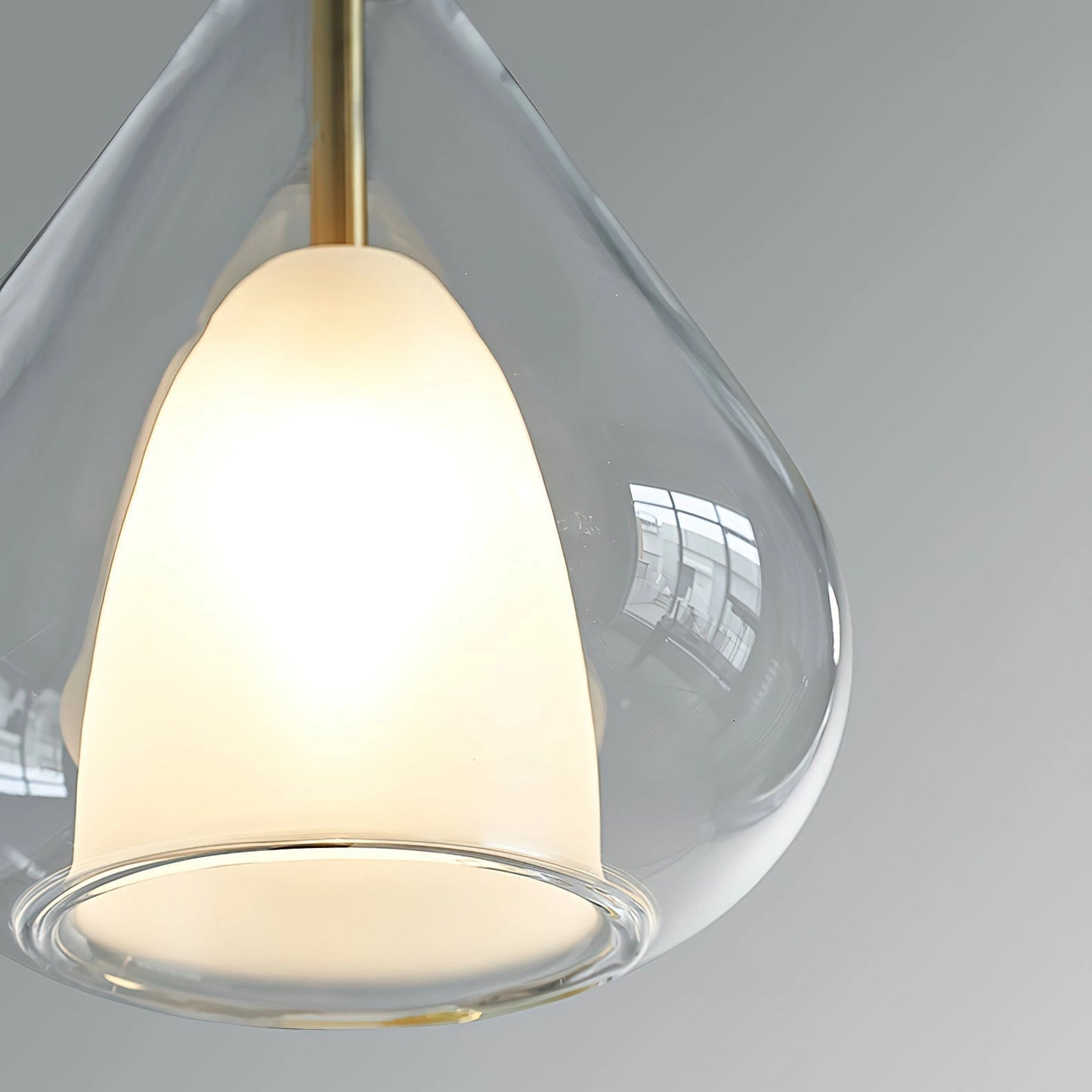 Nordic style pendant lamp with a clear raindrop design and starlight effect hanging from the ceiling.