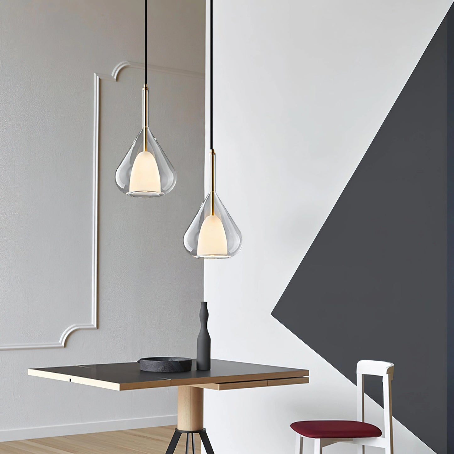 Nordic style pendant lamp with clear raindrop design and starlight effect, illuminating a modern interior space with wooden furniture and wall decor.