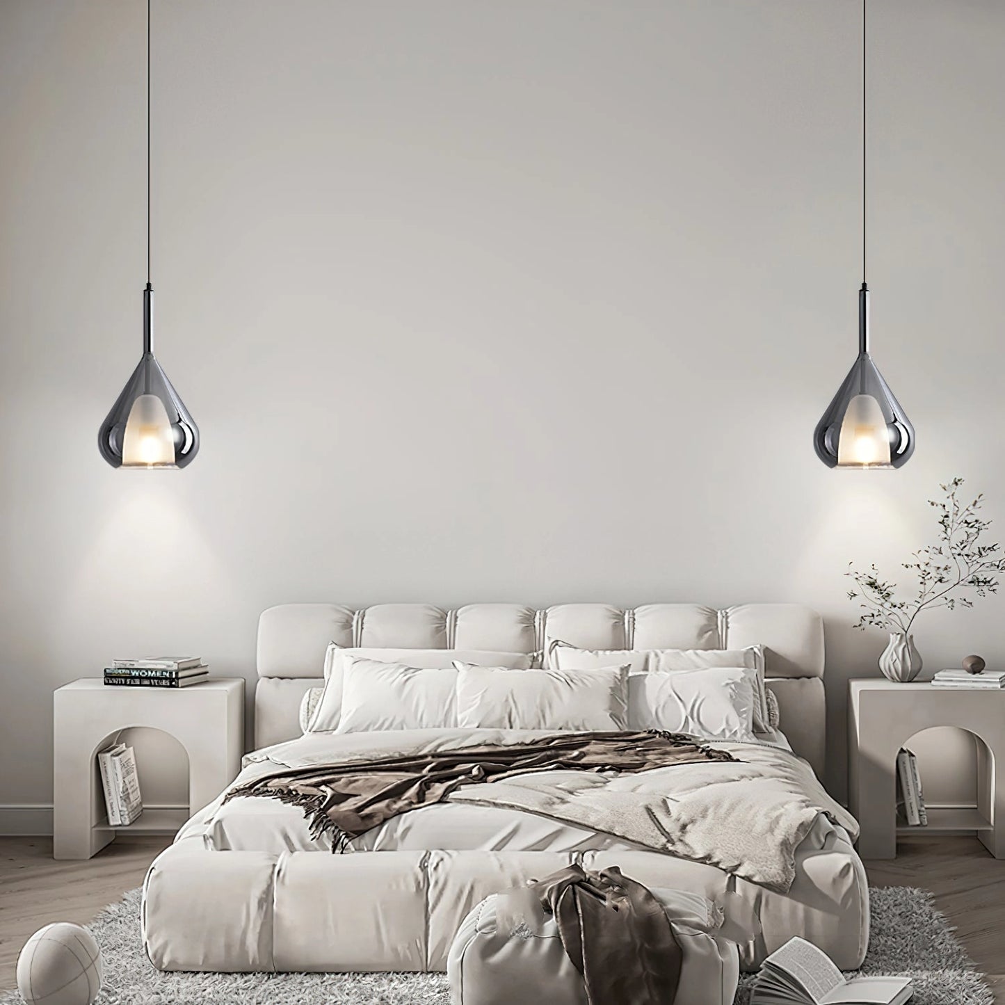 Nordic style pendant lamp with clear raindrop design and starlight effect, hanging in a modern interior with white and black furniture, wood accents, and comfortable lighting.