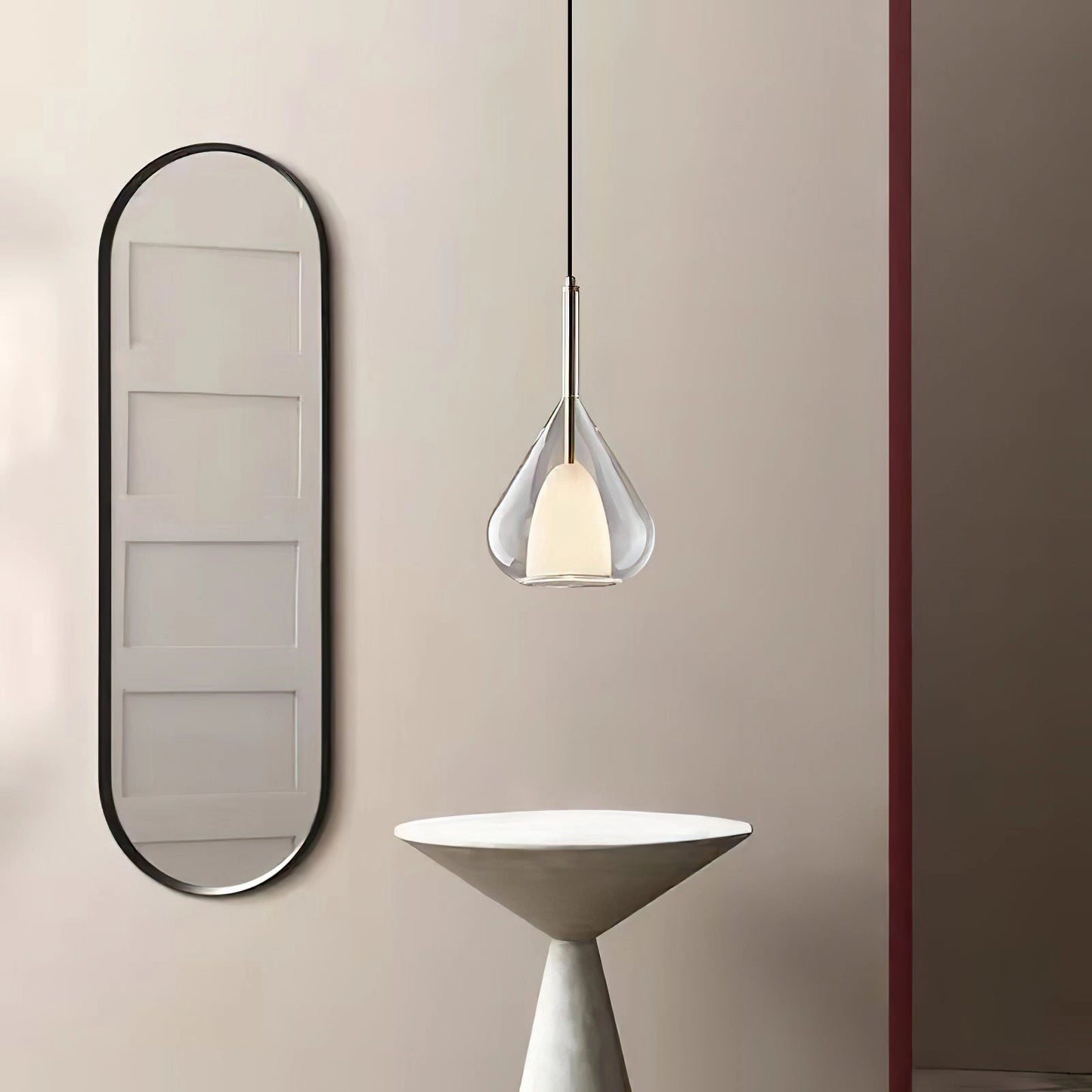 Nordic style pendant lamp with a clear raindrop design and starlight effect, featuring a combination of metal and glass materials, suspended from the ceiling.