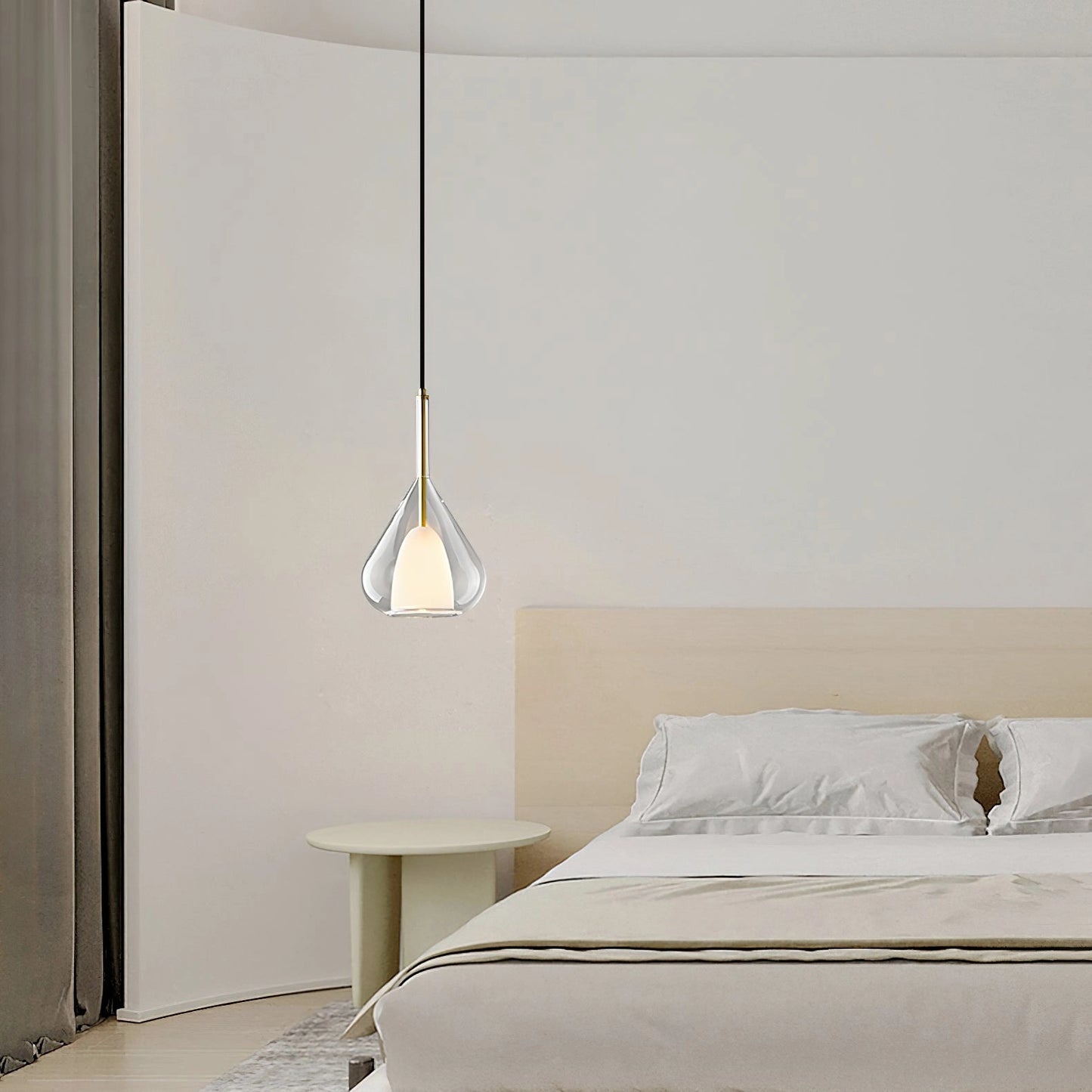 Nordic style pendant lamp with clear raindrop design and starlight effect, hanging in a modern grey interior with wooden flooring.