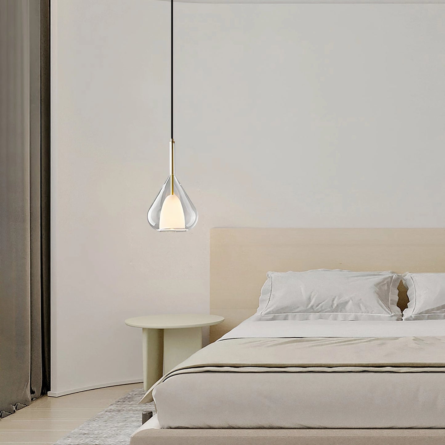Nordic-style clear raindrop pendant lamp with starlight effect, hanging in a modern interior with wooden accents and grey furniture.